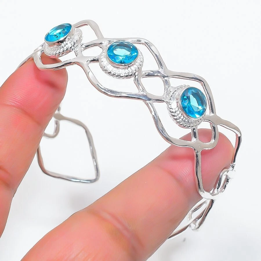 Brazalete ajustable suizo de plata de ley 925 con piedras preciosas de topacio azul Foto 1 de 1