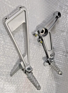 APRILIA - RS/Tuono 660 Right Footrest Bracket with Foot Peg #2B005203 #2B010851 - Picture 1 of 11
