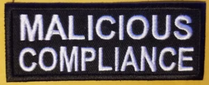 Parche bordado MALICIOUS COMPLIANCE aprox 1,5x4" - Imagen 1 de 2