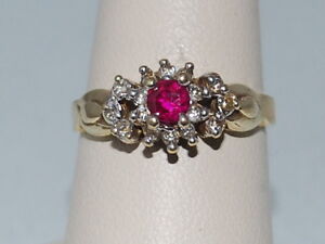 10k Yellow Gold Ring With Synthetic Pink Tourmaline In A Halo Of Cubic Zirconia