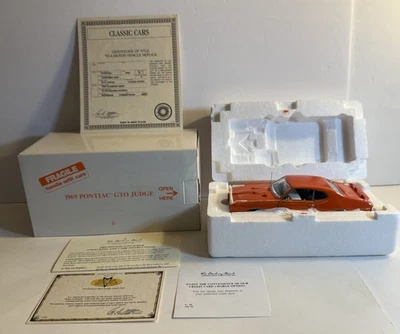 Pontiac GTO JUDGE 1969 DANBURY COMO NUEVO ESCALA ROJA 1:24 CON CERTIFICADO DE AUTENTICIDAD Y CAJA Foto 1 de 4