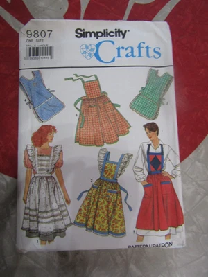 UNCUT Simplicity WOMAN'S Bid APRONS In 6 STYLES Sewing PATTERN #9807 - 1990 - Image 1 of 2