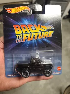 HOT WHEELS RETRO ENTERTAINMENT BACK TO THE FUTURE 1987 TOYOTA PICKUP TRUCK - Picture 1 of 4