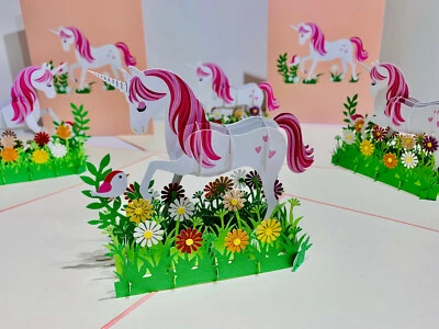 Tarjeta de felicitación emergente 3D rosa blanco hada unicornio feliz cumpleaños margarita jardín Foto 1 de 4