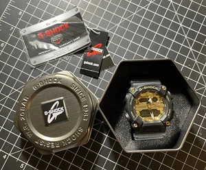 Casio G-Shock Men's Watch GA-900AG Quartz Sport Gold Black - Picture 1 of 2