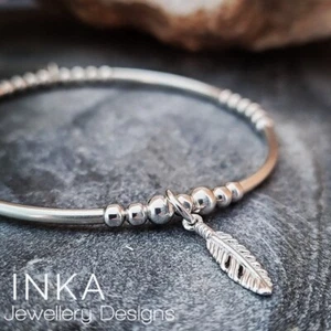 925 Sterling Silver bead & noodle Feather Stacking Stretch Bracelet By INKA - Picture 1 of 7
