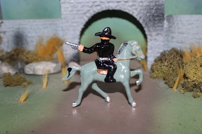 JUGUETE DE PLOMO BARCLAY VAQUERO "BART NEGRO" BANDIDO A CABALLO DISPARANDO HACIA ATRÁS-1940 Foto 1 de 4
