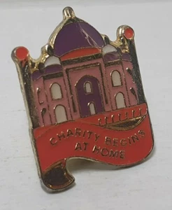 GLOBAL CANCER CONCERN CHARITY BEGINS AT HOME TEMPLE PIN BADGE COLLECTABLE - Picture 1 of 2