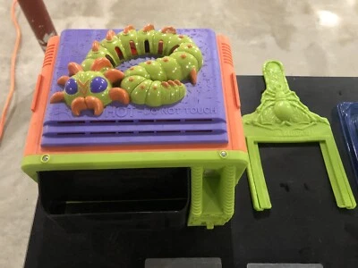 Vintage Creepy Crawler Toy With Toy Story Plates - Image 1 of 3