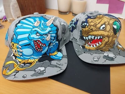 (2) 1997 Vtg Kids Extreme Dinosaurs Hat Cap Tags SnapBack t-Bone On Back Mattel - Image 1 of 4
