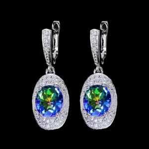 Pendientes colgantes Huggie de cristal azul claro fuego arco iris ovalados plateados - Imagen 1 de 10