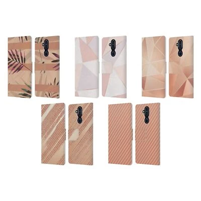 CAPA CARTEIRA LIVRO COURO OURO ROSA OFICIAL ALYN SPILLER PARA TELEFONES NOKIA - Imagem 1 de 4