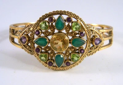 Bracelete Nicky Buttler tom dourado com várias pedras preciosas - Imagem 1 de 4