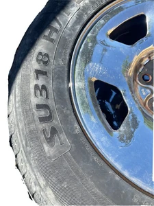 used Ford 17 inch rims and tires . Tread Is Ok Maybe Another 5,000 Miles . - Picture 1 of 3