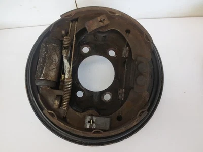 Kawasaki Mule 3010 2006 gas usado OEM panel de placa de respaldo de freno trasero izquierdo Foto 1 de 3