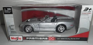 New Maisto Premiere DC Ford Shelby Series One 1:24 Die Cast Silver White Stripes - Picture 1 of 8