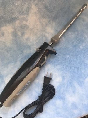 Cuchillo eléctrico con 2 cuchillas dentadas de acero inoxidable * 110 vatios Foto 1 de 3