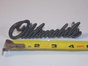 Vtg 1976 77 Oldsmobile Car Vehicle Front Grille Nameplate Emblem Badge 552015 - Picture 1 of 4