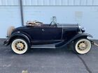 1931 Ford Model A  1930 Ford Model A roadster. Blue exterior, brown interior, tan top. Clean car!