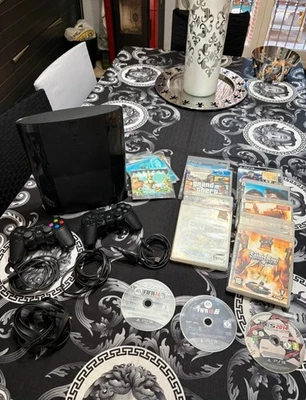 Console Sony PlayStation 3 - Super Slim 12GB  con 2 dualshock 12 giochi e 9 film - Immagine 1 di 4