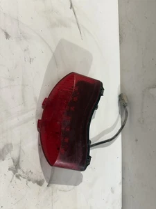 2008-2012 TRIUMPH STREET TRIPLE 675 675R REAR BACK BRAKE TAIL LIGHT OEM WORKS - Foto 1 di 3