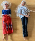 Two Vintage Barbie With Clothes