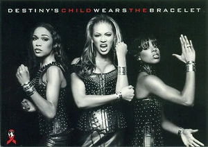 CARTOLINA PROMOZIONALE - IL BAMBINO DEL DESTINO INDOSSA IL BRACCIALETTO - BEYONCE KNOWLES - Foto 1 di 2