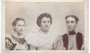 Three Ladies in a 1900's posed photograph affixed to a mounting board - Picture 1 of 1