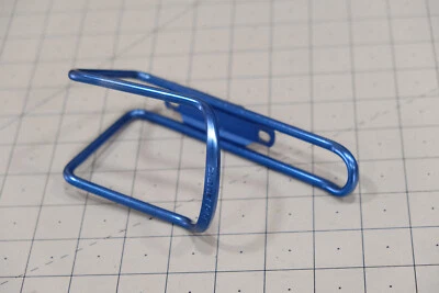 Jaula para botellas de agua Planet Bike azul carretera montaña grava Foto 1 de 4