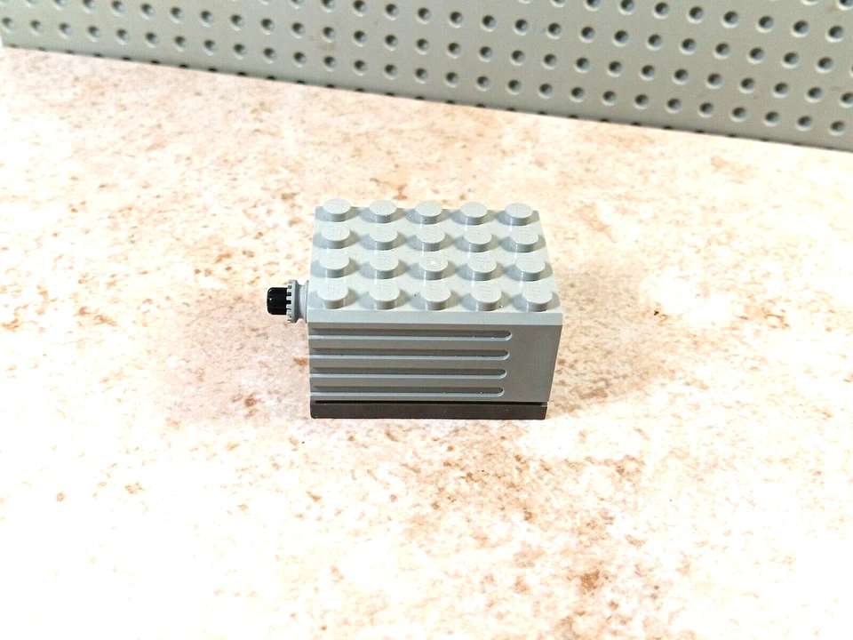 LEGO 9V Technic Electric Motor 9V 5 x 4 x 2 1/3 Dark Gray Base 9883 Light Gray - Image 1 of 1