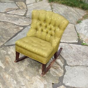 Antique child's upholstered wood rocking chair