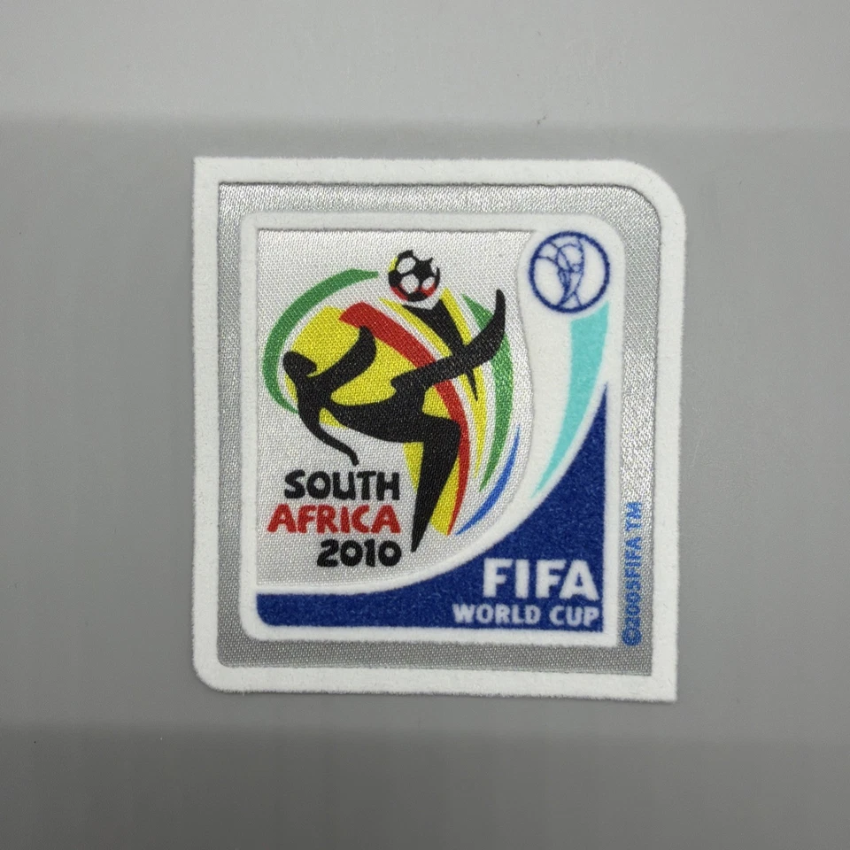 Camiseta de la Copa Mundial de la FIFA de Sudáfrica 2010 parche insignia de jugador estampado de hierro Foto 1 de 1