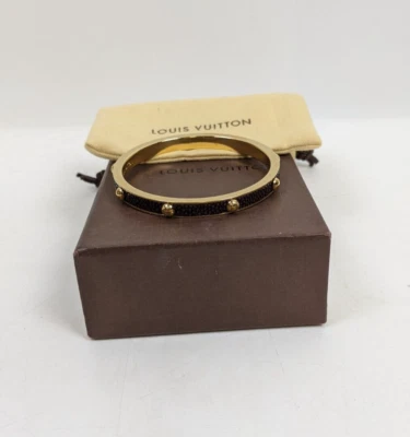 Brazalete Luis Vuitton Gimme A Clue Cuero Raya Negro Tono Dorado Foto 1 de 4