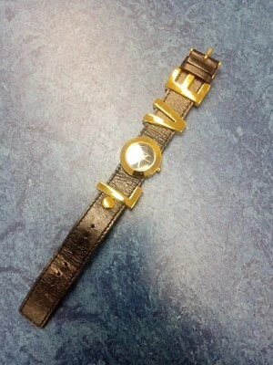 BCBG Womens LOVE Watch. Gold tone Large Letters, Black Leather Band. No Battery  - Image 1 of 4