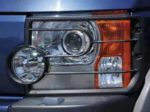 LAND ROVER LR3/DISCOVERY 3 PAR DE PROTECTORES DE LUZ DELANTERA GENUINOS PARTE # VUB501200 - Imagen 1 de 5