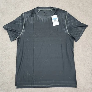 Nike Hombre Mediano A.P.S. Top versátil de manga corta Dri-Fit Adv negro FN2971-053 - Imagen 1 de 11