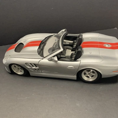 Burago Shelby 1999 Serie 1 Die Cast Modelo 1:18 Plateado Rojo Raya Foto 1 de 4