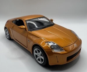 NISSAN 350Z SILVER 1:24 SCALE MAISTO RARE RARE FIND MUST HAVE ORANGE /GOLD - Picture 1 of 19