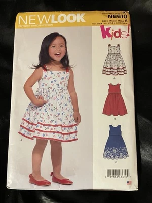 UNCUT! New Look Kids! Dress Sewing Pattern by New Look, N6610, Sizes 1/2-4 - Image 1 of 2