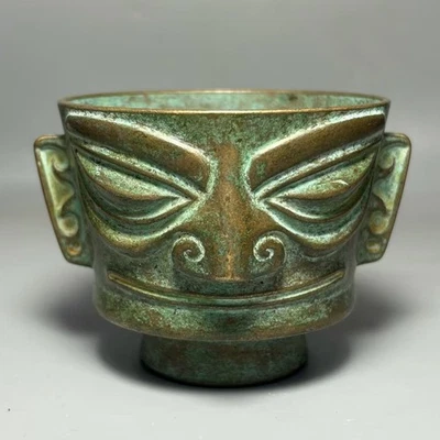 Taza máscara Sanxingdui bronce Foto 1 de 4