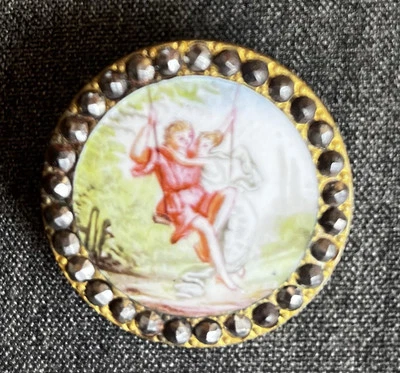 ANTIQUE PAINTED ENAMEL button 1 3/8" Lovers Swinging w/ CUT STEEL BORDER   - Image 1 of 4