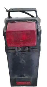 PARAFANGO FANALINO TELAIETTO PORTATARGA ORIGINALE SUZUKI DR 650 1990 - Foto 1 di 4