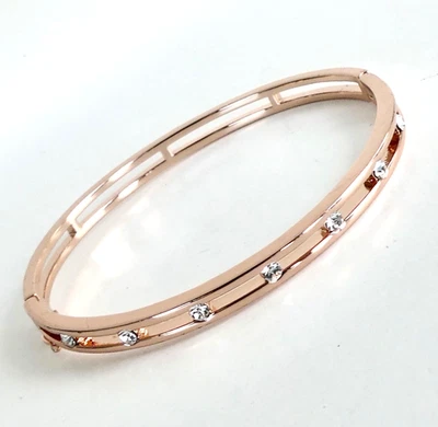 ROSE GOLD TONE HINGED BANGLE CHANNEL BRACELET - CRYSTAL CLEAR RHINESTONES - Image 1 of 4
