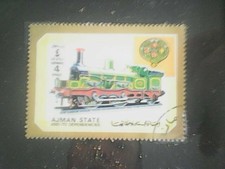 francobollo ajman state 4 ryials 1972 raffigura un treno incorniciato 
