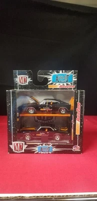 M2 Machines Auto Zone AUTO-LIFT Special Edition 1969 Camaro/1969 Charger - Image 1 of 4