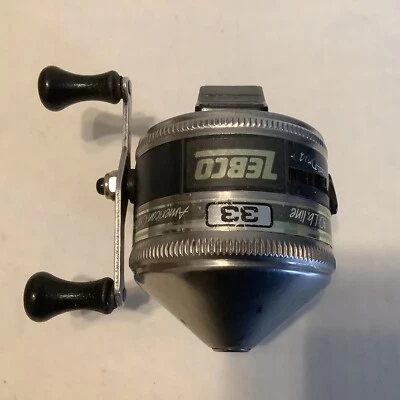 CARRETE SPINCASTING CARA CERRADA RAYA PLATEADA ZEBCO #33 VINTAGE HECHO EN EE. UU. Foto 1 de 4