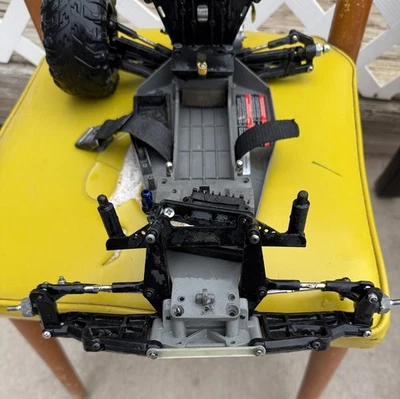 Missing Shocks: 2 Traxxas Rustler chassis 2wd 1/10 Stadium Truck Roller Slider  - Image 1 of 4