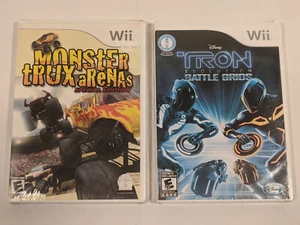 Nintendo Wii Games Lot of 2 Monster Trux Arena's Tron Evolution Battle Grids - Picture 1 of 5