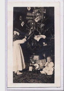 Real Photo Postcard RPPC - Girl Infant Toys and Decorated Christmas Tree - Picture 1 of 2