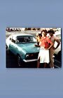 FOUND COLOR PHOTO P+2326 PRETTY BLACK WOMEN POSED BY OLD CAR